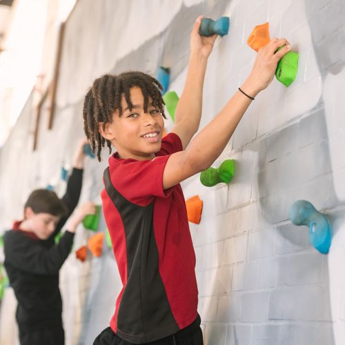 PE Boy on climbing wall 6