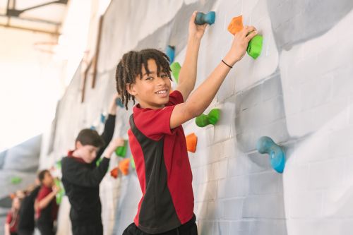 PE Boy on climbing wall 6